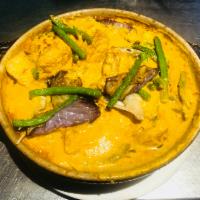 E2. Indian Curry Asam fish head or stingray fish Casserole · One of signature dish fish with onion, lady finger, string beans, tomato, crispy tofu and eg...