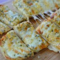 Cheese Garlic Bread · Garlic bread, shredded cheese and Singas sauce on the side.