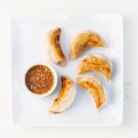 The Sweet Potato Potsticker · Pan-seared, gluten-free potstickers filled with roasted sweet potato, fresh garlic, and fres...