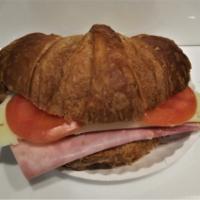 Ham, Provolone and Tomato Breakfast Sandwich · Served on a plain or whole wheat croissant.