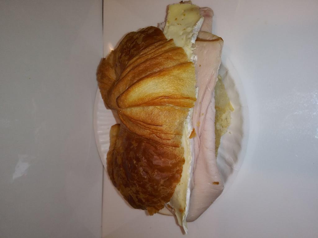 Smoked Turkey with Brie Cheese and Truffle Butter Breakfast Sandwich · Served on plain or whole wheat croissant.