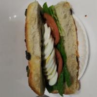 Olive Pocket Sandwich  · Tomato, Lettuce, Hard boiled egg.