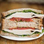 Grilled Chicken Breast Sandwich · With tomatoes, romaine lettuce, watercress, basil mayo and Dijon mustard on whole wheat bread