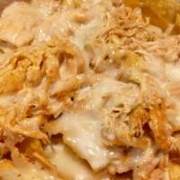 Nachos with Chicken Shredded · Nachos with Cheese, Shredded Chicken (cooked with peppers and onions) and Cheese Sauce.