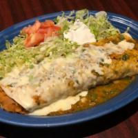 El Burro Loco · One Jumbo Burrito stuffed with rice beef tips and cheese dip. Topped with green sauce and se...