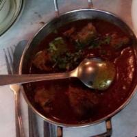 11. Beef Vindaloo · Very hot curry with potatoes, delicious variety of flavor. Spicy.