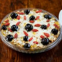Harpelli's Classic Coconut Bowl Breakfast · Base of banana, oats, cinnamon and almond milk, topped with granola, blueberry, goji berry, ...