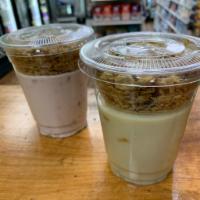 Yogurt Parfait · Base of Non-Dairy or Greek Yogurt with Fruit Combinations topped with Maple Granola - Call u...