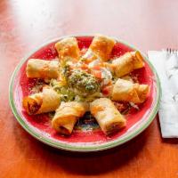 Taquitos · 2 rolled deep fried flour tortillas filled with your choice of chicken or picadillo. Topped ...