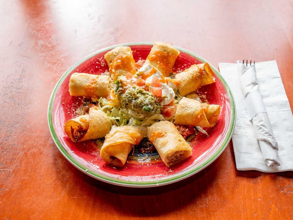 Taquitos · 2 rolled deep fried flour tortillas filled with your choice of chicken or picadillo. Topped with Parmesan cheese and served with guacamole and sour cream.