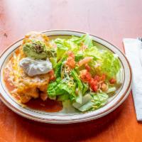 Deluxe Chimichanga · Choice of ground beef, chicken or picadillo. Served enchilada style, with salad, rice and be...