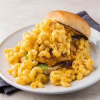 The Mac Burger · 1/3 Pound Angus beef patty with cheddar cheese and piled high with our house made mac and ch...
