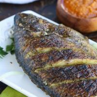 Grilled Tilapia Jerk Whole Tilapia · Served with side seasoned with lemon pepper, complete seasoning with onion sauce.