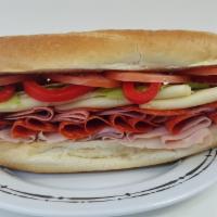 13. The Godfather Sandwich · Ham, salami, pepperoni and provolone cheese with lettuce, tomato, sweet peppers, oil and vin...