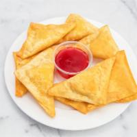 19. Crab Rangoon · 8 pieces. Fried wonton wrapper filled with crab and cream cheese.
