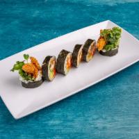 Spider Roll · Deep fried soft shell, avocado, cucumber, mix crab sprouts and fresh gobo.