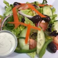 House Salad · lettuce, tomatoes, red onions, mesclun, green peppers, cucumber and Kamalata olives.