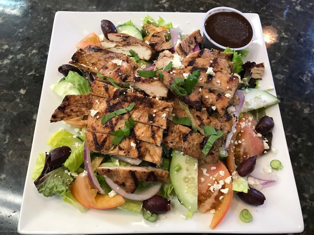 Chicken Greek Salad · Grilled or crispy chicken, lettuce, mesclun, tomatoes, red onions, cucumbers, Kalamata olives and feta cheese.