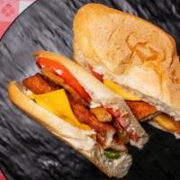 Pascual Hero · Chicken breaded, bacon, fresh tomatoes, onion rings, jalapenos, American cheese, ranch dress...