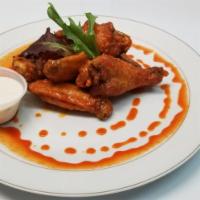 Authentic Buffalo Style Chicken Wings · Sided with blue cheese sauce!