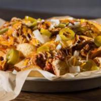 Irish Nachos · If you want to try the chips but need a little something extra, look no further. Our house-m...