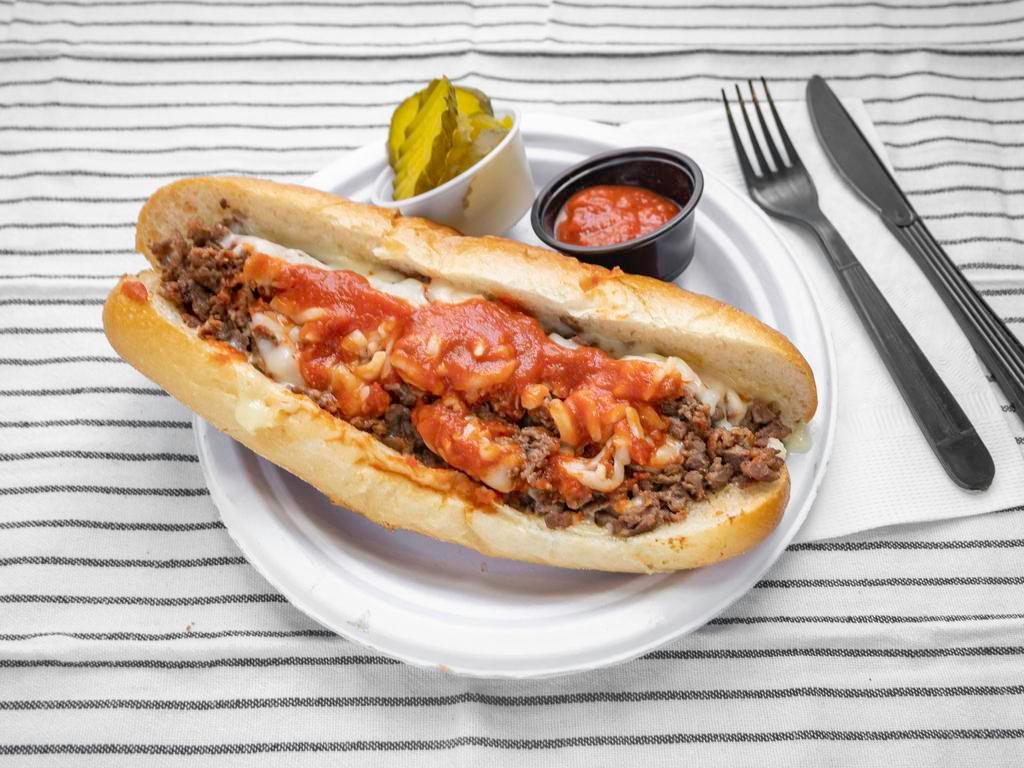 Pizza Cheese Steak · Steak served with sauce and mozzarella cheese on a fresh Italian Roll.