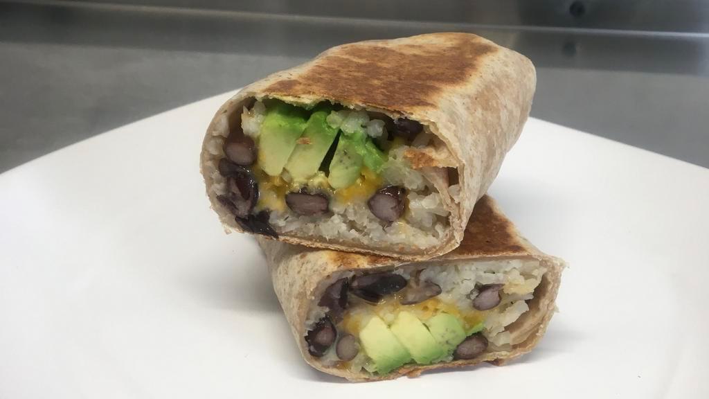 Kids Wrap · Spanish rice, organic black beans, cheddar cheese, and sliced avocado in a whole wheat wrap. Grilled until golden brown.