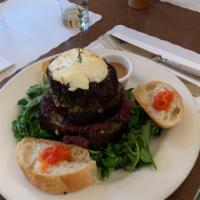 Grilled Eggplant · tapenade, goat cheese and parmesan pesto on watercress, served with red pepper spread on bag...