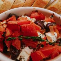 Baked Feta · tomatoes, black olives, capers and thyme, served with French baguette.
VEGETARIAN