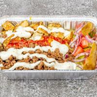 7. Combo Plate · Gyro, chicken, rice, lettuce, cucumber, tomatoes, red onion, pickle, white sauce, and hot sa...