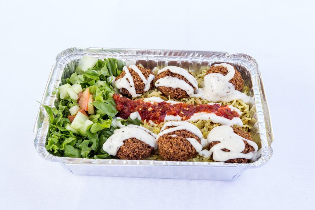 8. Falafel Plate · Falafel, rice, lettuce, cucumber, tomatoes, red onion, pickle, white sauce, and hot sauce.