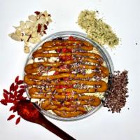 Super Vegan Bowl · Acai topped with: almond slices, chia, hemp, cacao nibs, goji berries, mac nuts, almond butt...