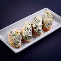 Spinach Artichoke Canapez  · Spinach, cream cheese, marinated artichokes, roasted garlic served on toasted crostini. 