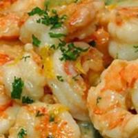 Camarones al Ajillo · Shrimp in garlic sauce.
comes with rice or tostones or green salad