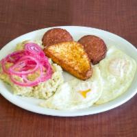 Mangu con Los Tres Golpes · Mashed plantains with fried eggs, fried cheese and fried salami.