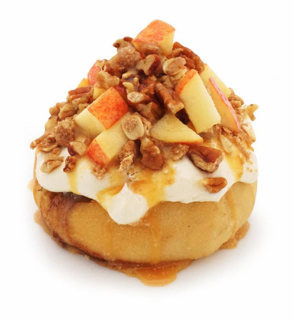Caramel Apple Pie Roll · caramel frosting topped with fresh apples, pecans, pie crumble, and caramel sauce