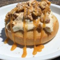 Sun City Roll · amaretto frosting topped with homemade pie crumbles, walnuts and caramel sauce