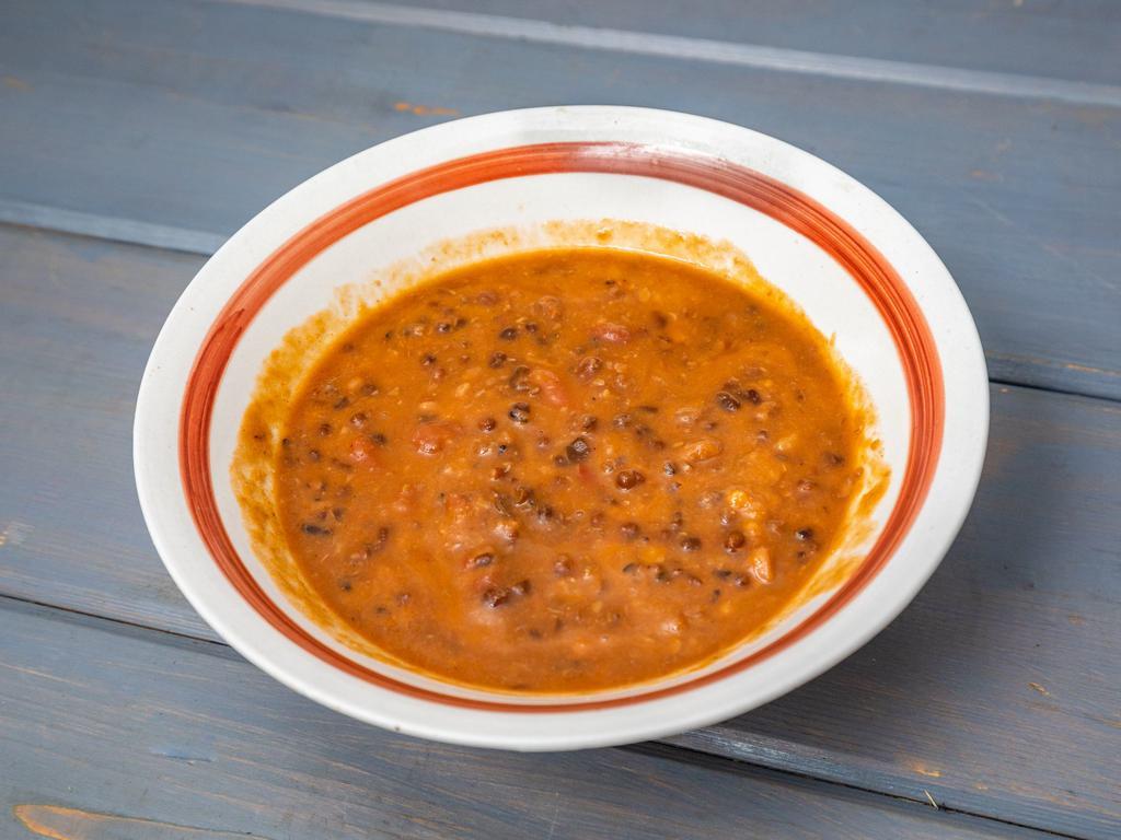 Madras Lentils · Lentils, red beans, and spices in a creamy tomato sauce.