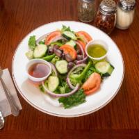 House Salad · Mixed greens, red onions, tomatoes, cucumbers, and balsamic vinaigrette.
