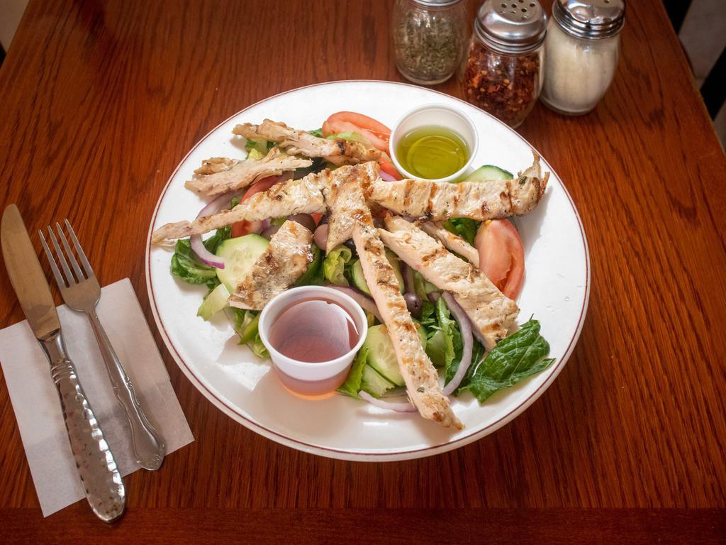Grilled Chicken Salad · Romaine hearts, red onions, tomatoes, cucumbers, grilled chicken and balsamic vinaigrette.
