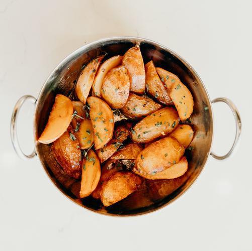 Lemon Potatoes · Lightly fried baby potatoes tossed with our lemon, herb and veggie broth.  Quite unique and delicious!