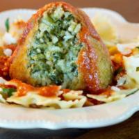 Gluten Free Vegetarian Arancini · Fully cooked. Arborio rice filled with spinach and a blend of cheeses, then coated in crunch...