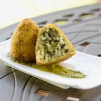 Vegetarian Arancini · Fully cooked. Arborio rice filled with spinach and a blend of cheeses, then coated in crunch...