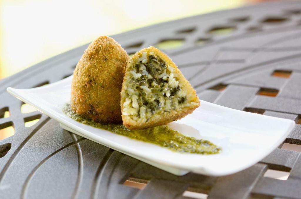 Vegetarian Arancini · Fully cooked. Arborio rice filled with spinach and a blend of cheeses, then coated in crunchy bread crumbs. Choose a size to see a price.