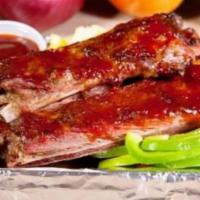 Smokey BBQ Ribs · Hickory smoked St. Louis style pork ribs cooked to fall off the bone perfection.