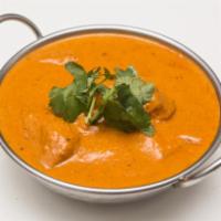 Chicken Tikka Masala  · Clay oven cooked with light cream tomato sauce. Server with Basmati rice.