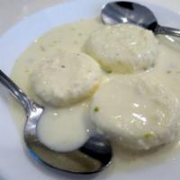 Rasmalai · Light cheese discs, thickened creamy milk, pistachio.