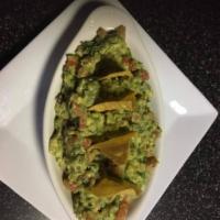 Guacamole · Cilantro, tomato, red onion and jalapenos with plantain chips.