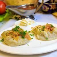Manti · Steamed Uzbek Dumplings filled with choice of lamb and beef or pumpkin.
Served with a side o...