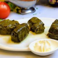 Toki-Dolma · 4 pieces. Uzbek grape leaves stuffed with rice, lamb, and beef.
Served with side of sour cre...